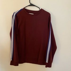 Maroon crewneck w/ blue & white stripes on sleeves